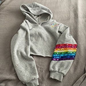 Lola + the Boys cropped hoodie with sequins details and stitching.